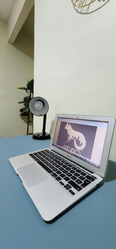 a laptop computer sitting on top of a table at hostal andino in Santiago