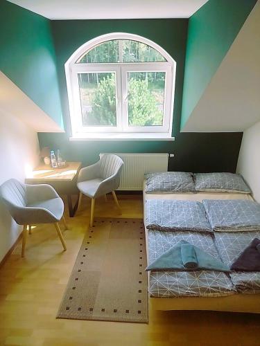 a room with two bunk beds and a window at Zajazd u Hermanów in Olsztyn