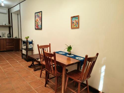 a dining room with a table and chairs at Maya Mountain Lodge in San Ignacio