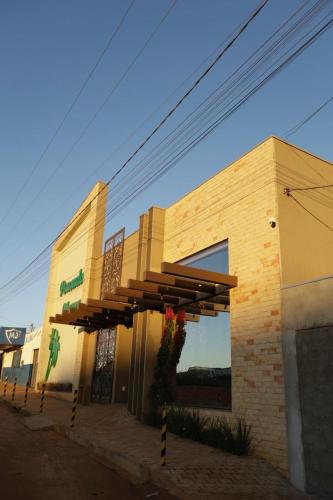 a building with awnings on the side of it at Hotel Pousada Marra in Catalão