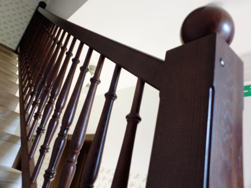 a close up of a wooden stair railing at Vila Mila in Bled
