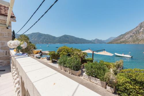 a view of the water from a house at Villa Blue Dream in Dobrota