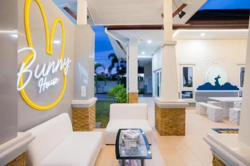 a lobby of a house with a burger king sign at Bunny House Pool Villa Na Jomtien in Na Jomtien
