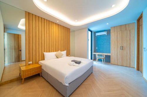 Postel nebo postele na pokoji v ubytování 4 bedrooms Light luxury modern villa Large space 15m L-shaped swimming pool Family and friends vacation