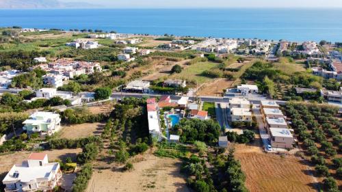 an aerial view of a small town with houses at Secret Garden Hotel in Maleme