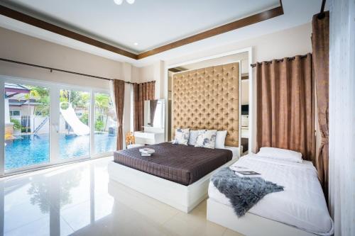 Ένα ή περισσότερα κρεβάτια σε δωμάτιο στο Destiny Pool Villa Na Jomtien