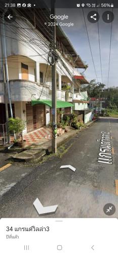 an empty street in front of a building at 34house in Betong