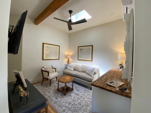 a living room with a couch and a table at Warner Hotel in Bisbee