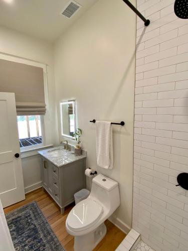a bathroom with a toilet and a sink at Warner Hotel in Bisbee