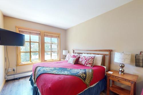 a bedroom with a large bed and a window at Copper Mountain Ski Hideaway in Copper Mountain