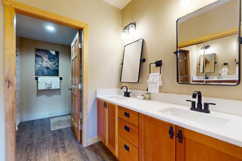 a bathroom with a sink and a mirror at Copper Mountain Ski Hideaway in Copper Mountain
