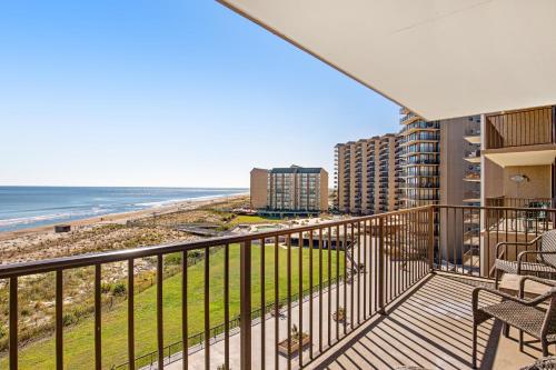 a balcony with a view of the beach and condos at Sea Colony - 604 Dover House Rd. in Bethany Beach