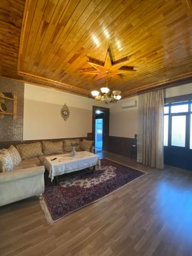 a living room with a couch and a star ceiling at Baku Eagle House in Mardakan