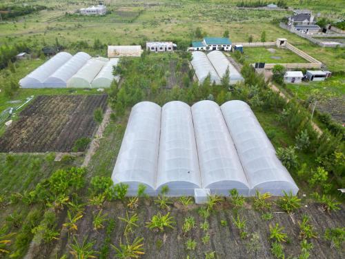 an aerial view of a farm with white domes at Ubuntu Kreative Village in Nairobi