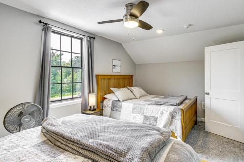 a bedroom with two beds and a window at Onamia Vacation Rental about 1 Mi to Mille Lacs Lake! in Isle