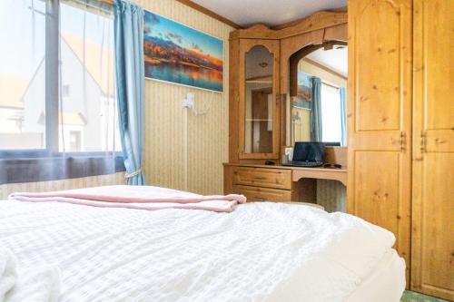 Ein Bett oder Betten in einem Zimmer der Unterkunft Basislager für Harz und Städtetour Leipzig, Magdeburg, Dessau, Halle, Quedlinburg uvm