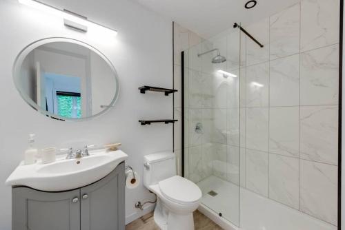 a bathroom with a toilet and a sink and a shower at La Crête 65 - 3 chambres - 6 personnes in Saint-Férréol-les-Neiges