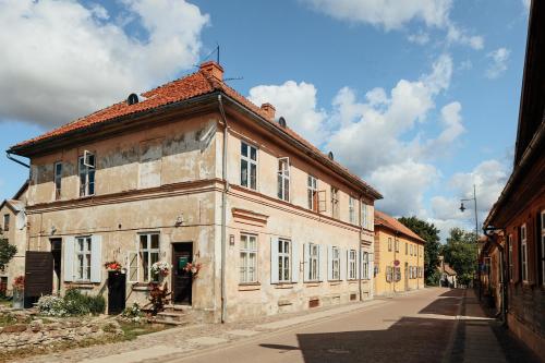 an old building on the side of a street at K&L Old Town Kuldīga in Kuldīga