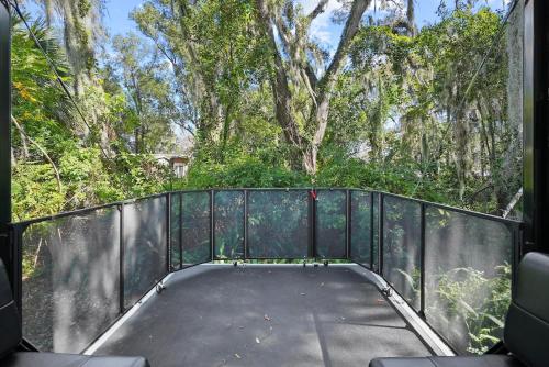 a view from the back of a bridge with trees at Cozy Rv Retreat Fast Wi-fi & Pet-friendly in Orlando
