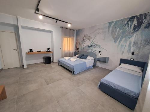 Postel nebo postele na pokoji v ubytování Azzurra Room