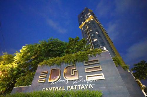 a building with a sign on the side of it at Edge Central Pattaya Seaview in Pattaya South