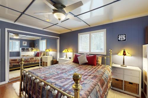 a bedroom with a bed and a ceiling fan at Kachina Village in Mountainaire