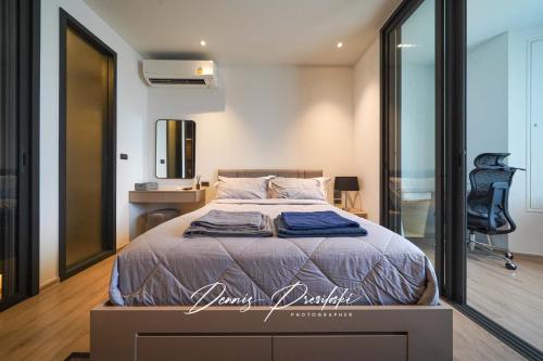 Ένα ή περισσότερα κρεβάτια σε δωμάτιο στο Edge Central Pattaya Seaview