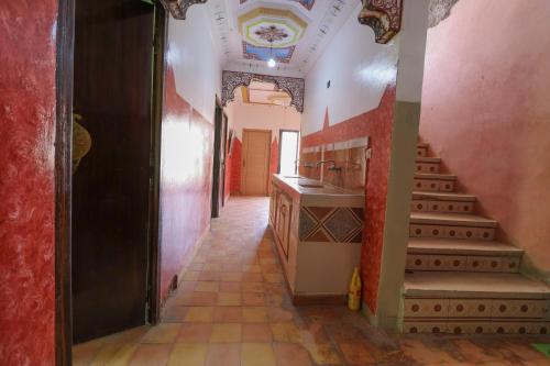 a hallway of a house with a staircase and a room at Gite Gougadir Imoughlad in Imlil