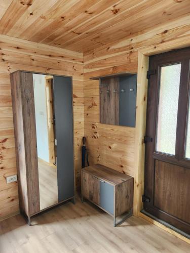 a log cabin with a door and a window at ViS in Žabljak