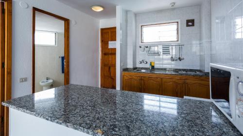 a kitchen with a counter top and a sink at Tagoror Beach Apartments - Adults Only in Playa del Ingles