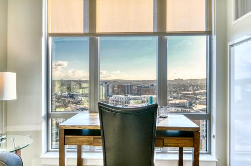 a dining room with a table and a large window at Gorgeous Apt Near Restaurants in Quincy