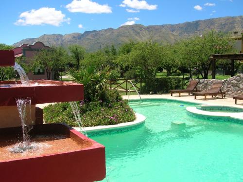 a fountain in the middle of a swimming pool at Posada Los Antiguos-Adults Only in Merlo