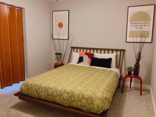 a bedroom with a bed with pillows on it at BOUTIQUE GARDEN HOUSE CHICAGO 3-STORY sleeps 12 in Chicago