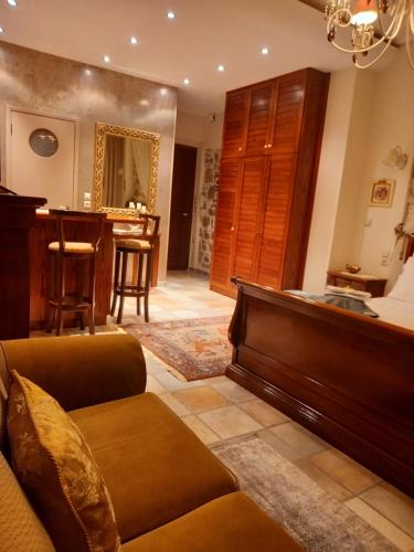 a living room with a couch and a table at Casa da Sogno Elegant Studio in Nafpaktos