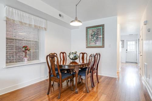 a dining room with a table and chairs at Peaceful & spacious family home near Carytown fully fenced in Richmond