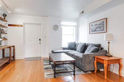 a living room with a couch and a table at Peaceful & spacious family home near Carytown fully fenced in Richmond