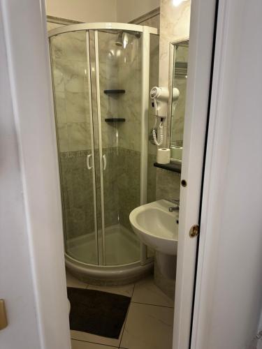 a bathroom with a shower and a toilet and a sink at Camere Margot in Monterosso al Mare