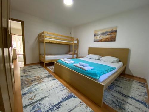 Postel nebo postele na pokoji v ubytování Apartment Centar