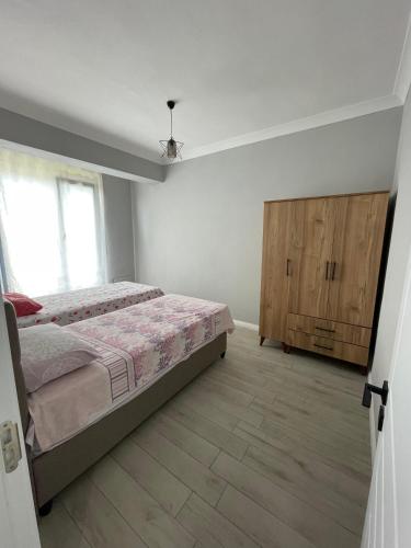 Postel nebo postele na pokoji v ubytování lotus tatil köyü