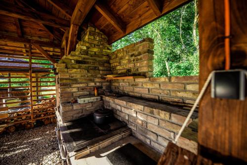 an inside view of a building with a brick wall at Glamping nad Sanem in Krzemienna