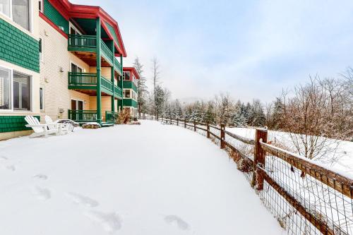 a snow covered yard in front of a building at Eagles Unit #2 in Jeffersonville
