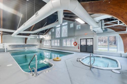 a large pool with two hot tubs in a building at Eagles Unit #2 in Jeffersonville