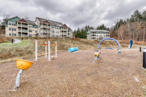 a playground with a bunch of play equipment at Eagles Unit #2 in Jeffersonville
