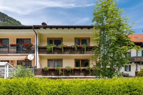 a building with flower boxes on its balconies at Appartement Schareckblick in Bad Gastein