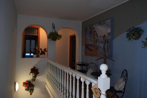 a staircase in a home with flowers on the wall at Brussa 340 in Brussa
