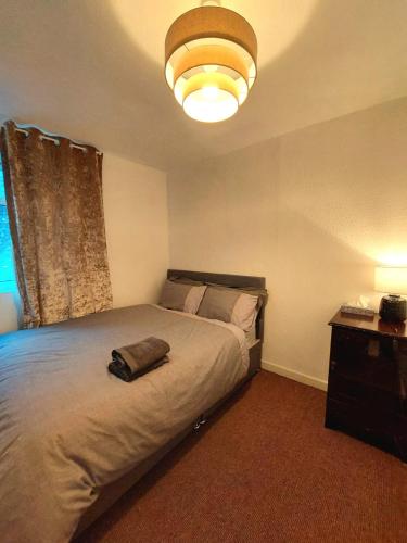 a bedroom with a bed with a bag on it at Liverpool Newington Stay in Liverpool