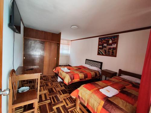 Cama o camas de una habitación en GRAN PUNO lNN