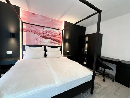 Postel nebo postele na pokoji v ubytování City Apartment with WIFI, Kitchen and 4K TV