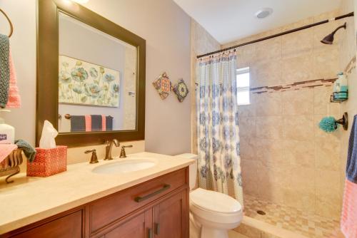 a bathroom with a toilet and a sink and a shower at Riverfront Getaway with Hot Tub and Game Room! in New Port Richey