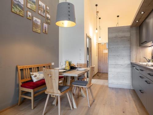 a kitchen and dining room with a table and chairs at Apart33 Top 2-12A in Haus im Ennstal